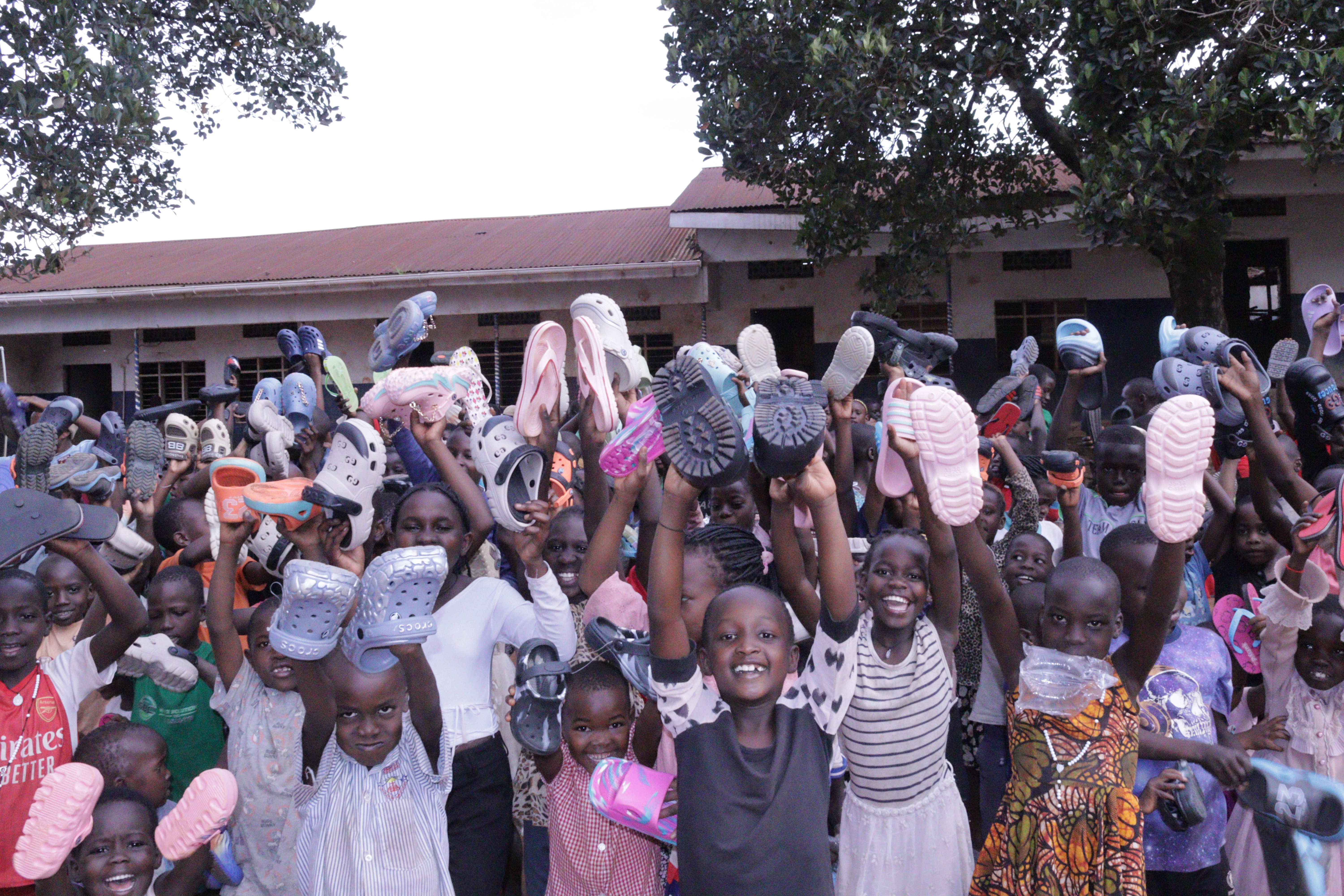 Children receiving shoes