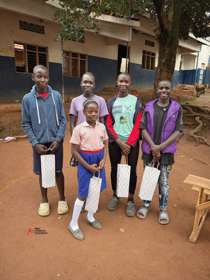 Students receiving success cards for Primary Leaving Examinations